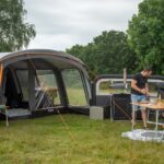 family outside air tent