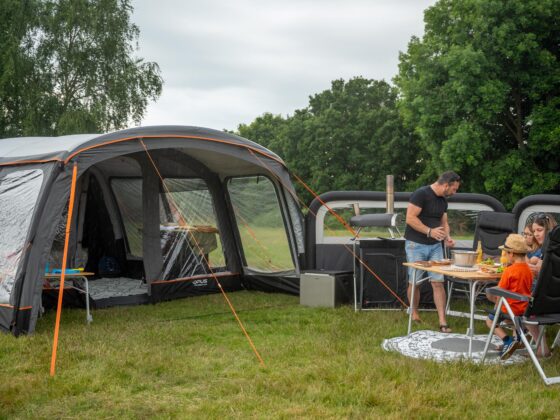 family outside air tent